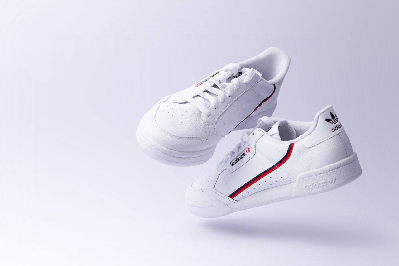 white adidas low-top sneakers